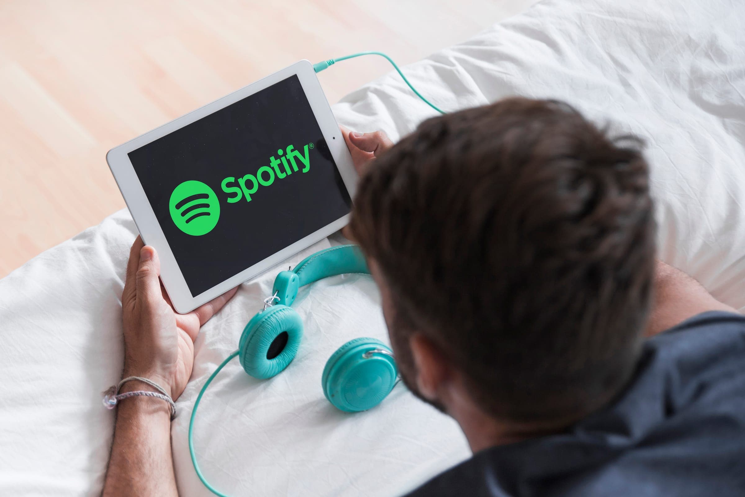 Person using Spotify on a modern device