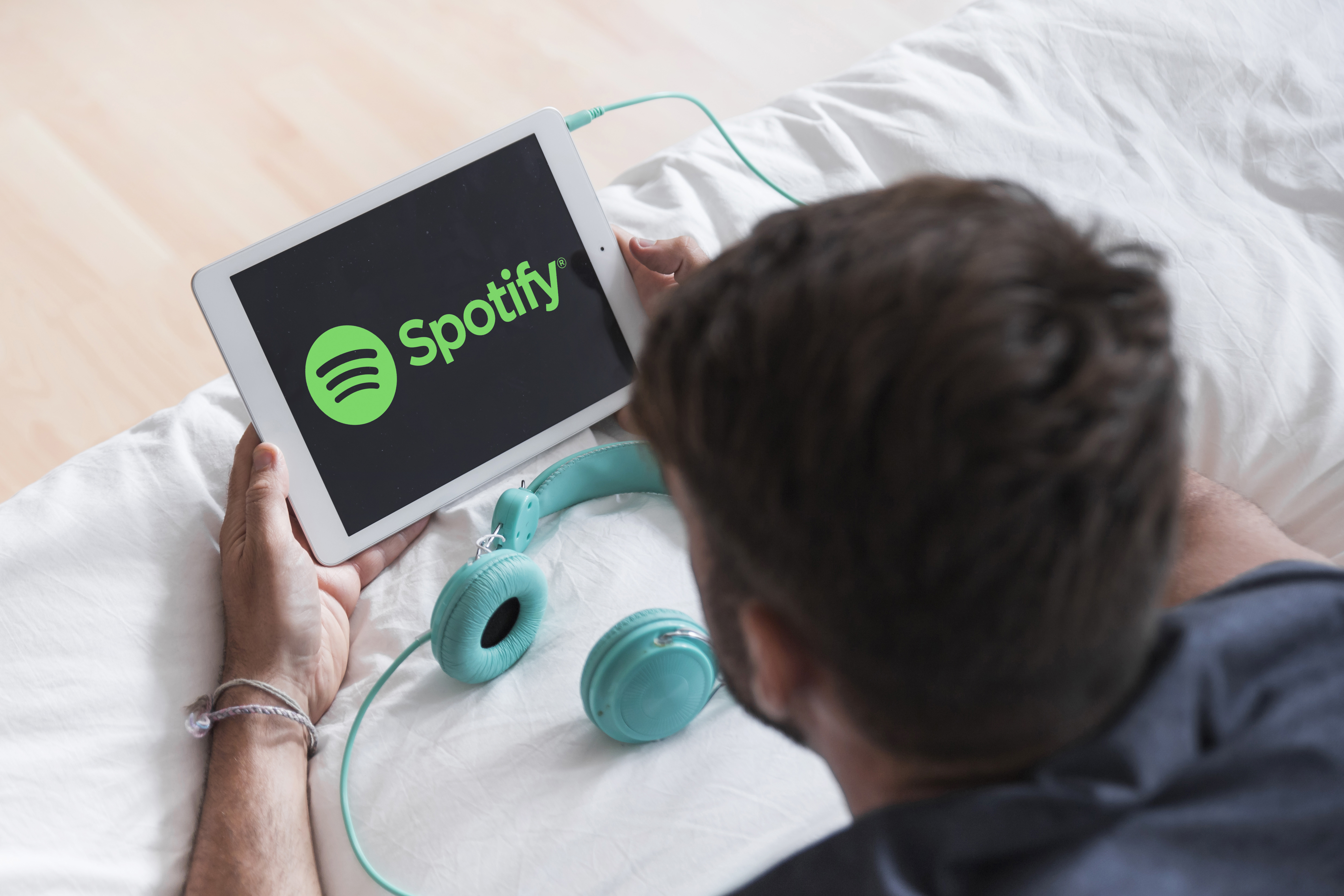 Person using Spotify on a modern device
